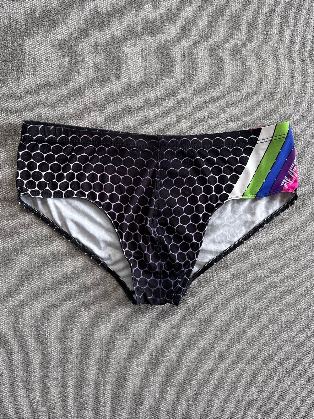 Rufskin Men's Black Geometric Hexagon Print Swim Brief with Rainbow Accent Small